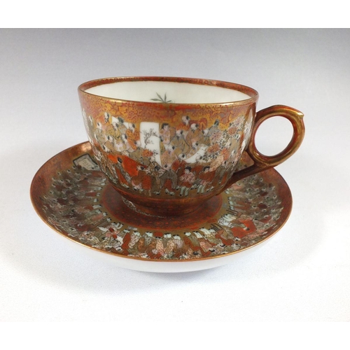 507 - A Japanese satsuma cup and saucer painted with the 