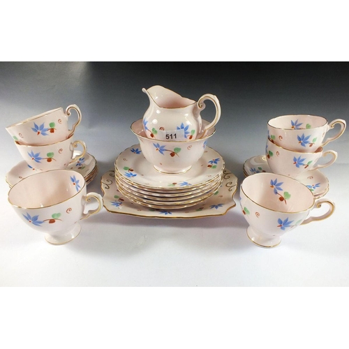 511 - A Tuscan tea service painted blue flowers comprising six cups and saucers, milk, sugar, six tea plat... 