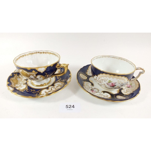 524 - Two Royal Crown Derby cobalt blue and gilt cabinet cups and saucers