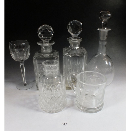 547 - Three cut glass decanters, Waterford hock glass, Brierley tankard engraved hops and a carafe