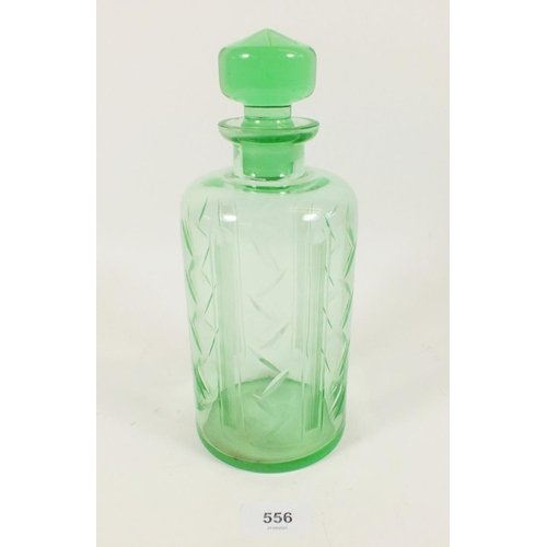 556 - A 1930s Art Deco Czech uranium glass decanter with symmetrical facet cut design, 24cm