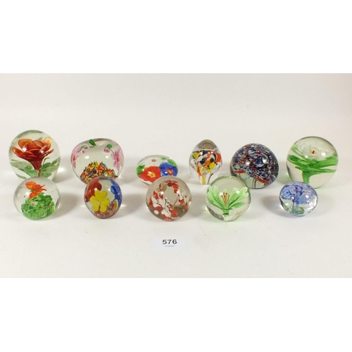 576 - A selection of 11 glass paperweights