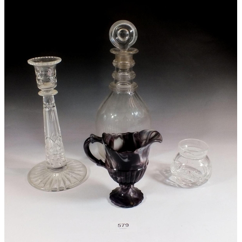 579 - A slag glass jug, cut glass decanter, candlestick and small cut glass pot