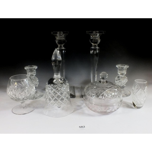 582 - A selection of cut glass items to include candlesticks, bell etc