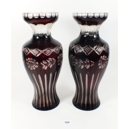 586 - A pair of red flashed and cut glass vases - 35cm