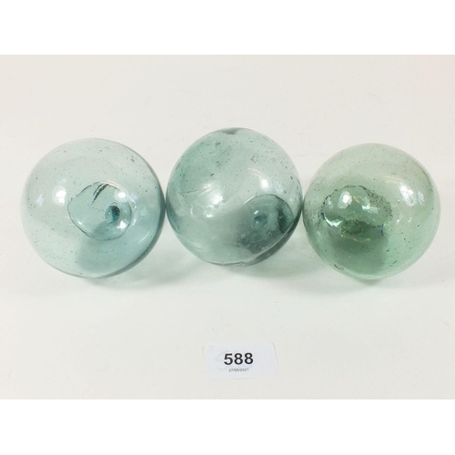 588 - A group of three Japanese hand blown glass fishing floats