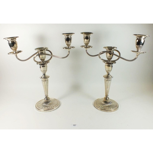 597 - A pair of large silver plated three branch candelabra