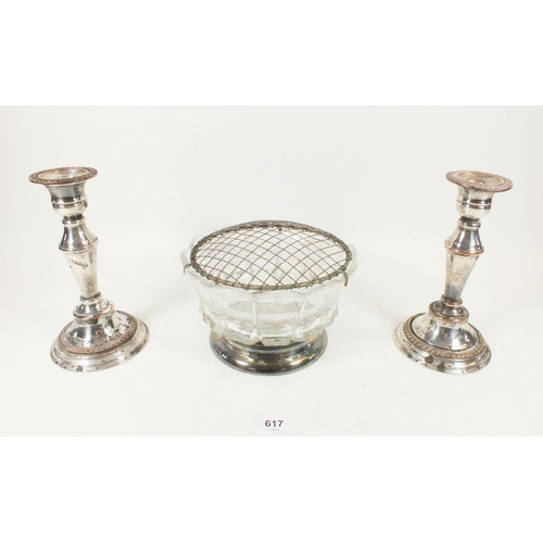 617 - A cut glass and silver plated rose bowl and two Sheffiled silver plated candle sticks