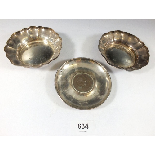 634 - A pair of silver pin dishes and a silver dish inset Churchill crown, 231g