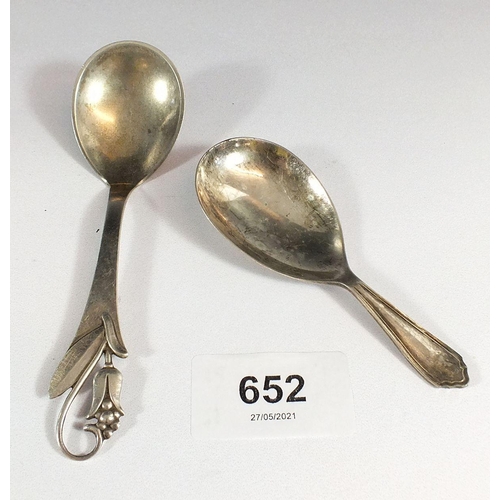 652 - A Danish silver Art Nouveau caddy spoon and a silver plated example