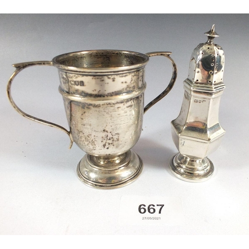 667 - A small silver trophy cup and a silver pepperette, 100g