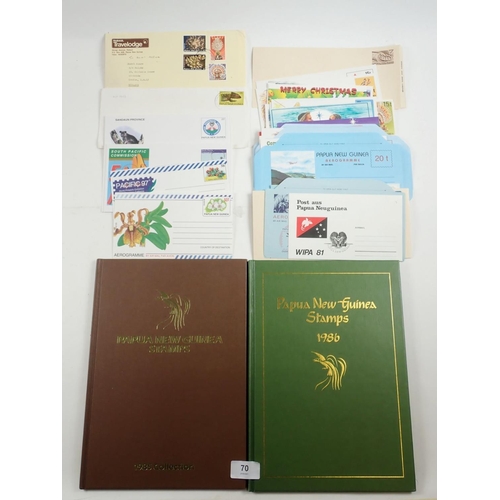 70 - Papua New Guinea: Large, c 60 page, stock-book of mint & used defin, commem etc plus 2 year-books fo... 