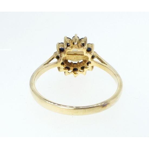 768 - A 9 carat gold pearl and sapphire cluster ring, size O, 2g