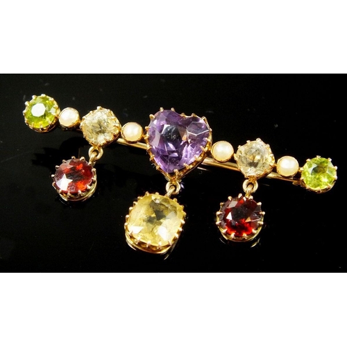 771 - A gold brooch set coloured stones and pearls including heart cut amethyst, peridot and crystal with ... 