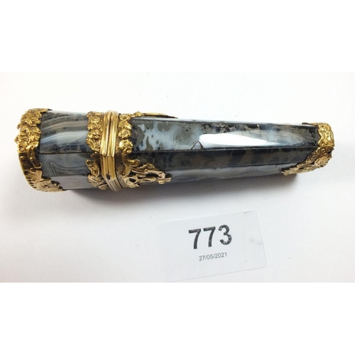 773 - An 18th century grey agate etui mounted with gold scrollwork decoration and set diamond, the hinged ... 