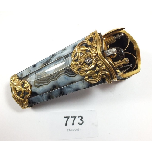 773 - An 18th century grey agate etui mounted with gold scrollwork decoration and set diamond, the hinged ... 