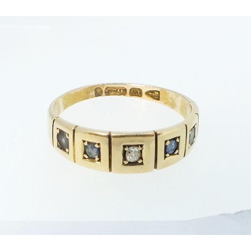 778 - A Victorian 15 carat gold ring set chip diamond flanked by two sapphires and two white stones - size... 