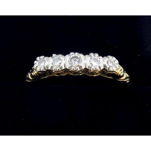 779 - A 14 carat gold ring circa 1920's illusion set five diamonds, size P