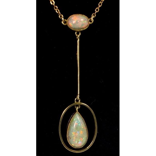 781 - A 14 carat gold Edwardian Art Nouveau pendant set opal and opal drop