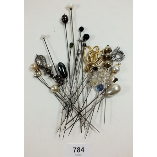 784 - A collection of hat pins