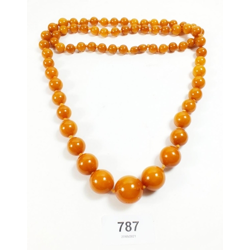 787 - A yellow simulated amber necklace, 88cm 84g