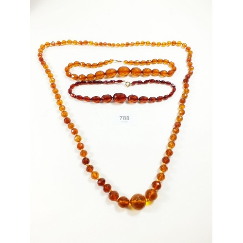 788 - Three various faceted amber coloured necklaces