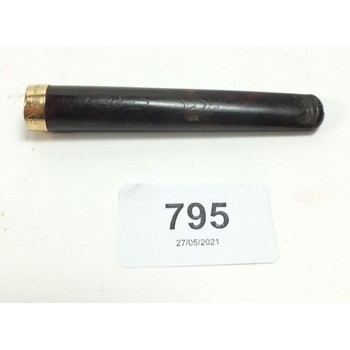 795 - A tortoiseshell cigarette holder with 15 carat gold mount