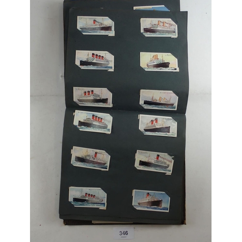 346 - Album of Wills cigarette cards - part sets including Merchant ships (49) Railway engines etc. (400+)