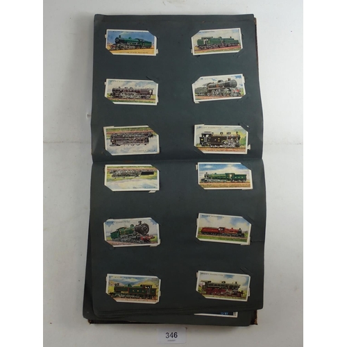 346 - Album of Wills cigarette cards - part sets including Merchant ships (49) Railway engines etc. (400+)