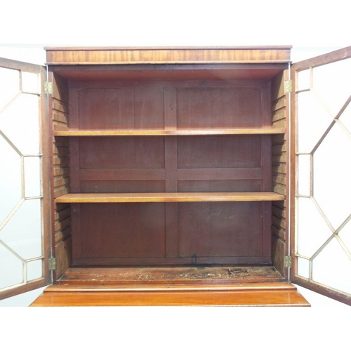 1023 - A 19th century mahogany secretaire bookcase with two glazed doors over associated base with secretai... 