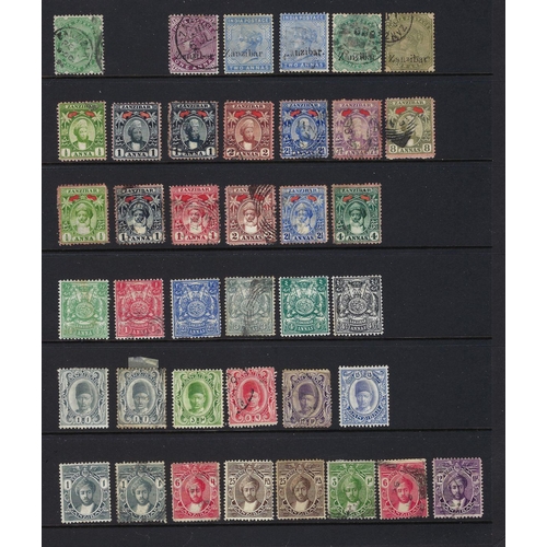 111 - Zanzibar: Four-page stock-page accumulation 1870s to 1950s incl India postally-cancelled or overprin... 