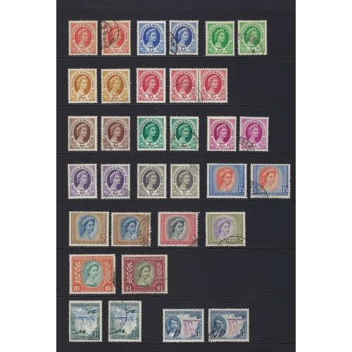 148 - Rhodesia & Nyasaland: 8 page folder mint & used collection of QEII defin, commem and postage due wit... 