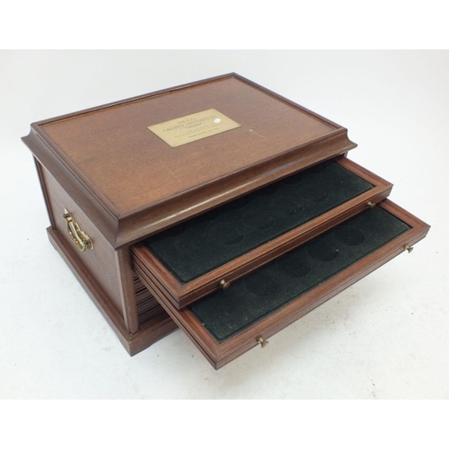 378 - A wooden coin cabinet with five drawers each fitted twenty crown sized pockets plus a deeper bottom ... 