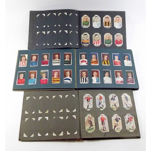 397 - A cigarette card album including Ogdens Football club colours, Wills Aviation, Wills Naval Dress and... 