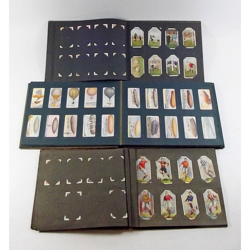 397 - A cigarette card album including Ogdens Football club colours, Wills Aviation, Wills Naval Dress and... 