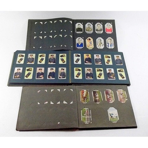 397 - A cigarette card album including Ogdens Football club colours, Wills Aviation, Wills Naval Dress and... 