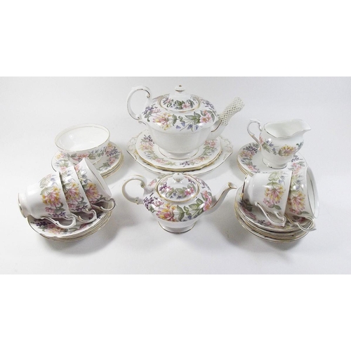 434 - A selection of Paragon 'Country Lane' teaware comprising: two teapots, three teacups, seven saucers,... 