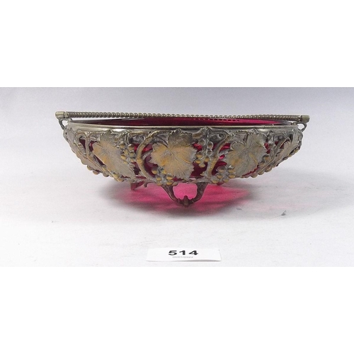 514 - A cranberry glass bowl in gilt metal vine cast stand