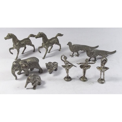 515 - A quantity of silver plated figurines to include peacocks, horses, elephants and a set of ballerinas... 