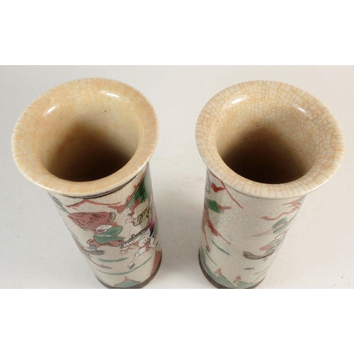 108 - A pair of Japanese crackle glaze cylindrical vases, painted warriors, 25cm tall