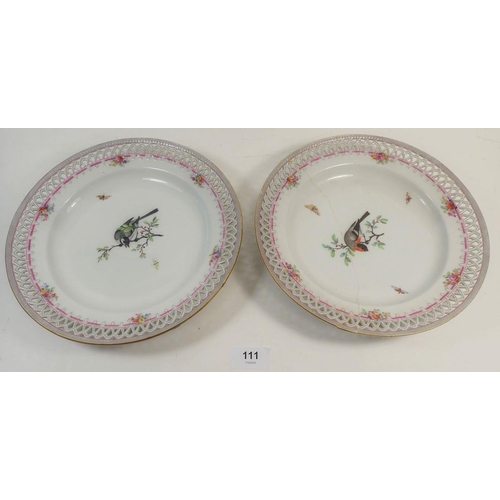 111 - A pair of Berlin plates with pierced borders, painted birds, one a/f, 24cm diameter