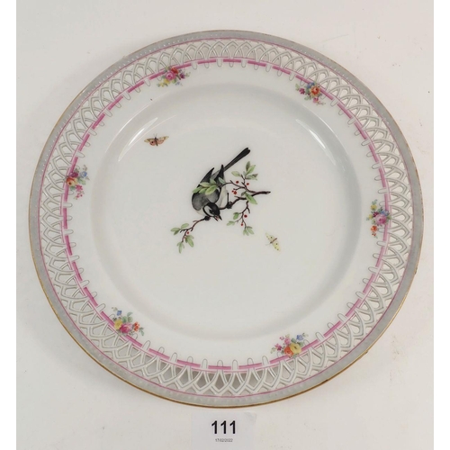 111 - A pair of Berlin plates with pierced borders, painted birds, one a/f, 24cm diameter