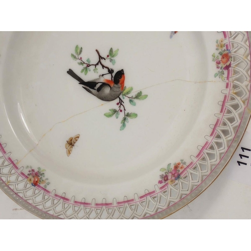 111 - A pair of Berlin plates with pierced borders, painted birds, one a/f, 24cm diameter