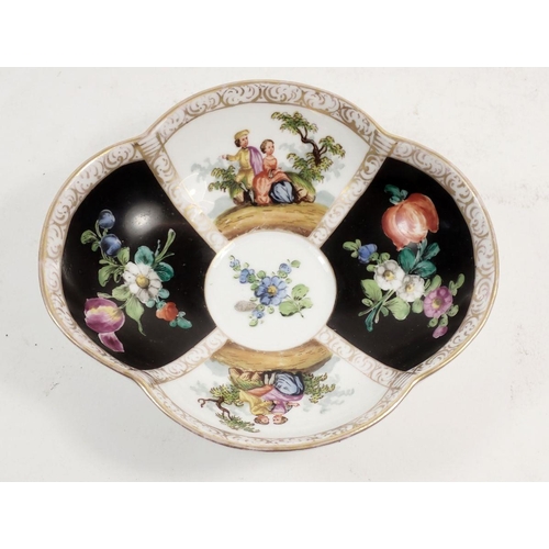 112 - A Dresden porcelain cabinet cup and saucer,  painted panels of flowers and courting scenes, A R mark