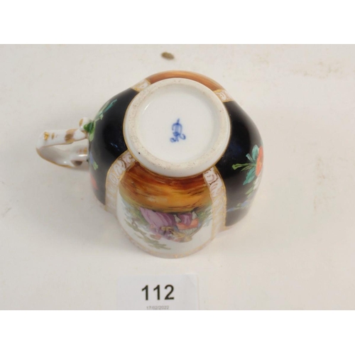 112 - A Dresden porcelain cabinet cup and saucer,  painted panels of flowers and courting scenes, A R mark