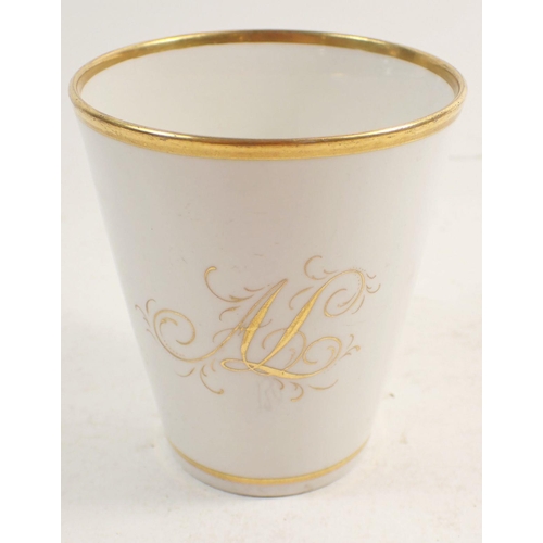 130 - A Worcester Flight Barr & Barr coffee can and saucer painted flowers and a gilt beaker with gilt A L... 