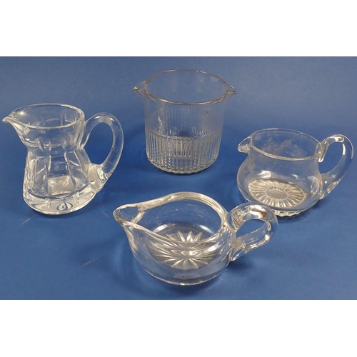 147 - Three 19th century heavy glass jugs and a rinser