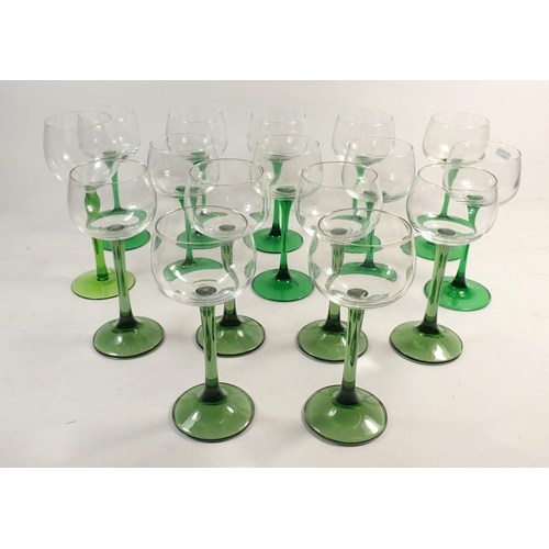 149 - A set of nine green stemmed hock glasses and a set of six similar