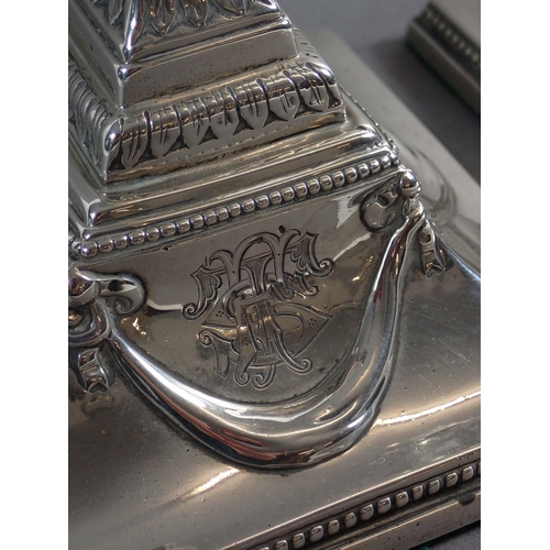 187 - A pair of large Georgian silver Corinthian column form candlesticks with Neoclassical swags and engr... 