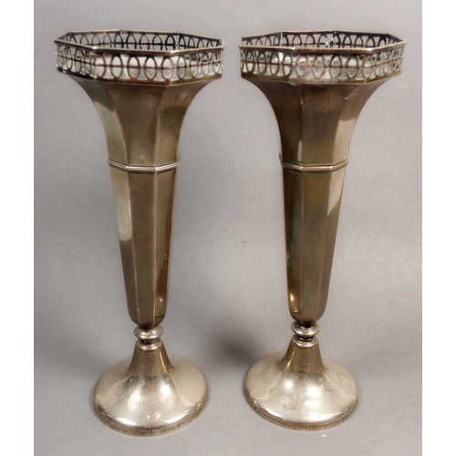 190 - A pair of silver fluted vases with pierced decoration, Birmingham, marks rubbed, weighted, approx 22... 